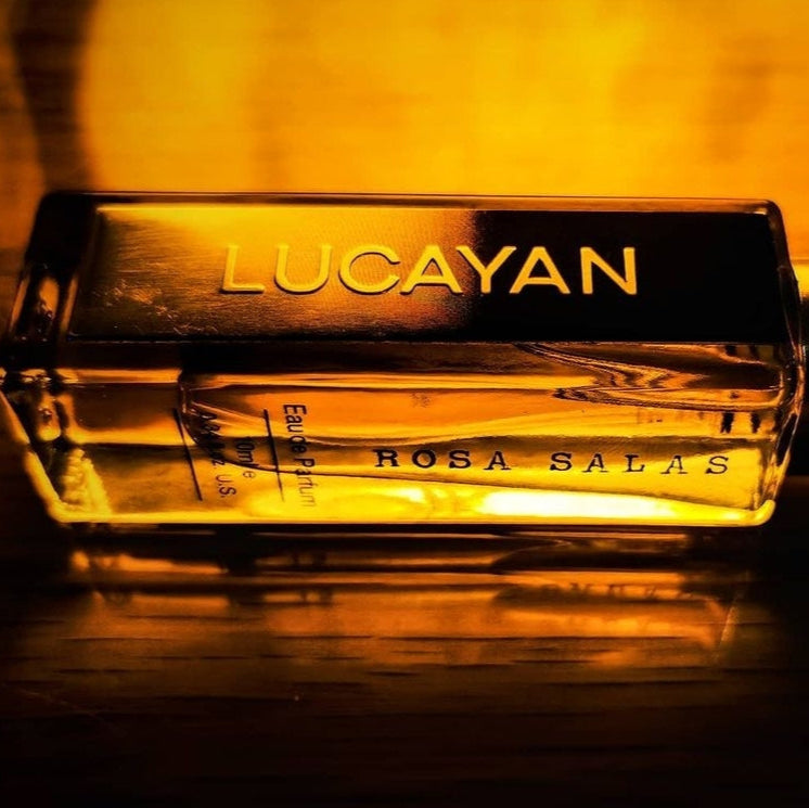 Lucayan Rosa Salas perfume bottle with a warm glow