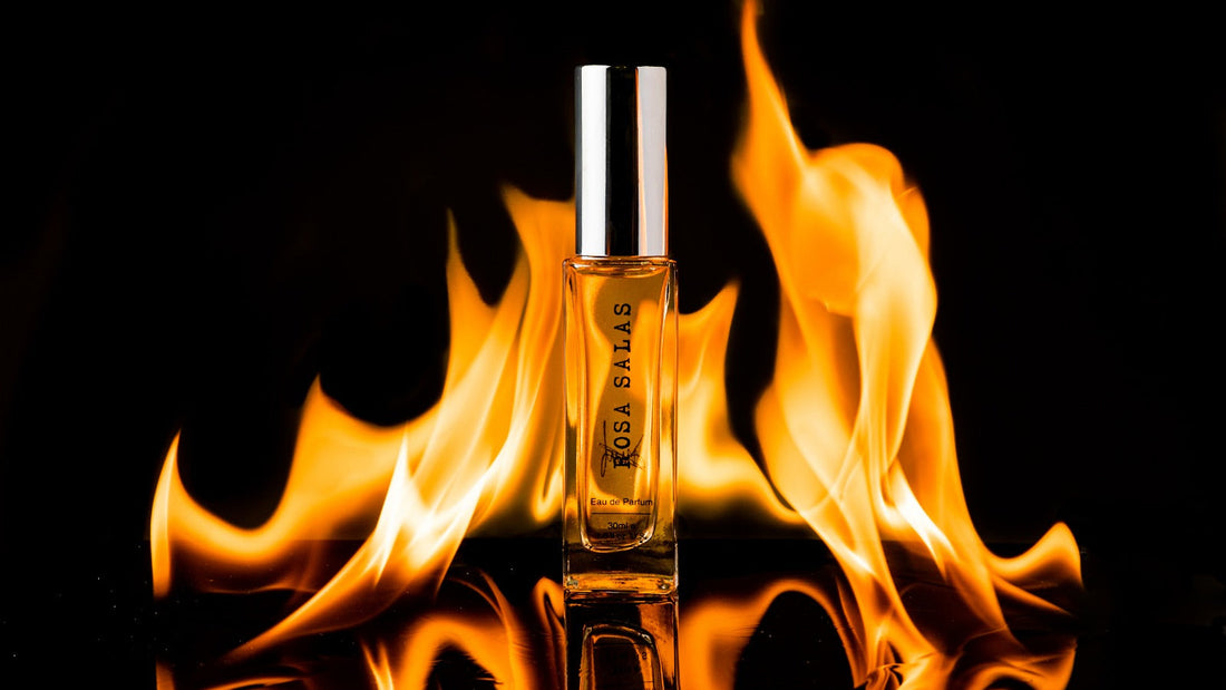 Perfume bottle with flames in the background