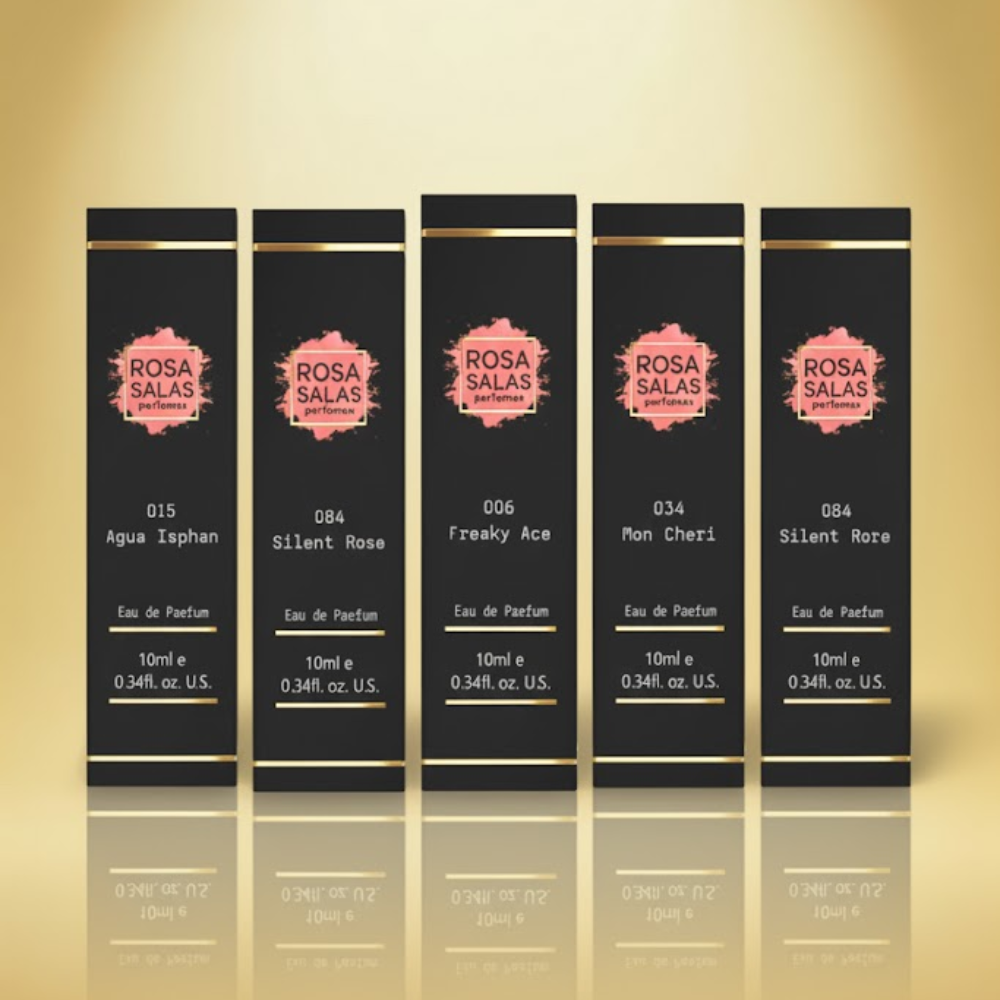 Five Rosa Salas perfume packaging on a reflective gold surface with a beige background